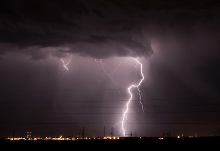 Lightning striking in an industrial location
